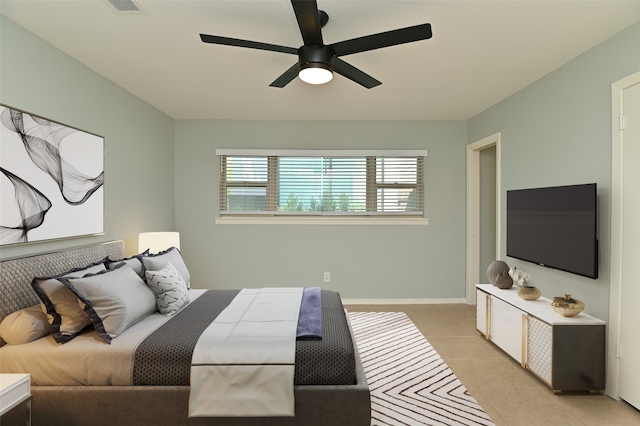 tiled bedroom with ceiling fan