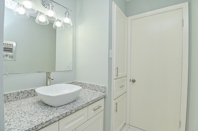 bathroom with tile patterned flooring and vanity