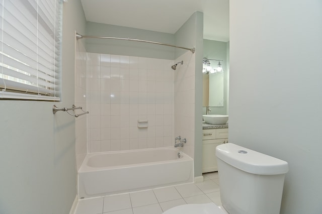 full bathroom with tile patterned flooring, vanity, toilet, and tiled shower / bath