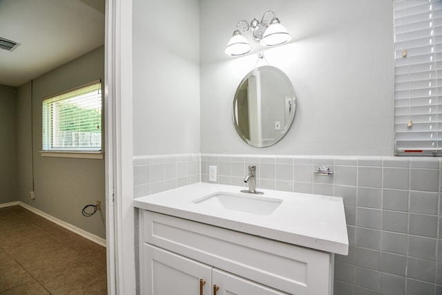 bathroom with tile patterned flooring and vanity