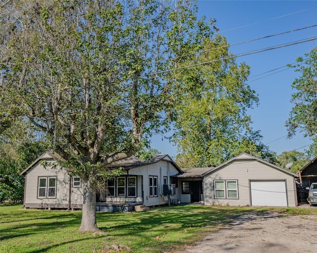 ranch-style home featuring a front yard and a garage