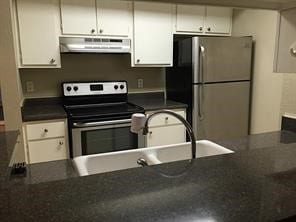 kitchen featuring white cabinets, sink, and appliances with stainless steel finishes