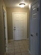 doorway to outside featuring tile patterned floors