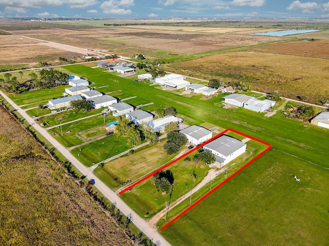 birds eye view of property featuring a rural view