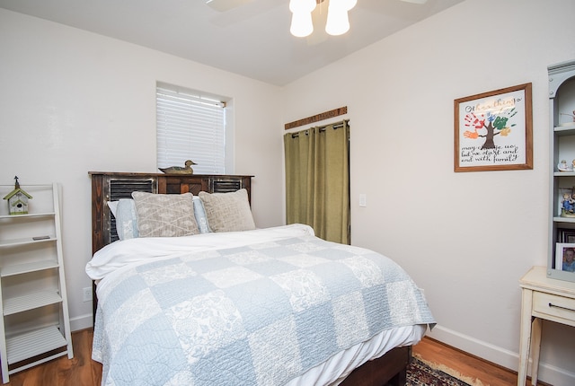 bedroom featuring hardwood / wood-style flooring and ceiling fan