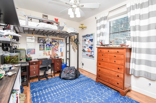 home office featuring ceiling fan and hardwood / wood-style flooring