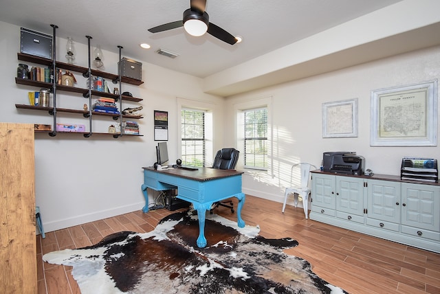 home office with ceiling fan and hardwood / wood-style floors