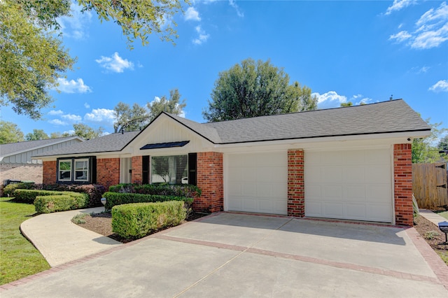 ranch-style house featuring a garage