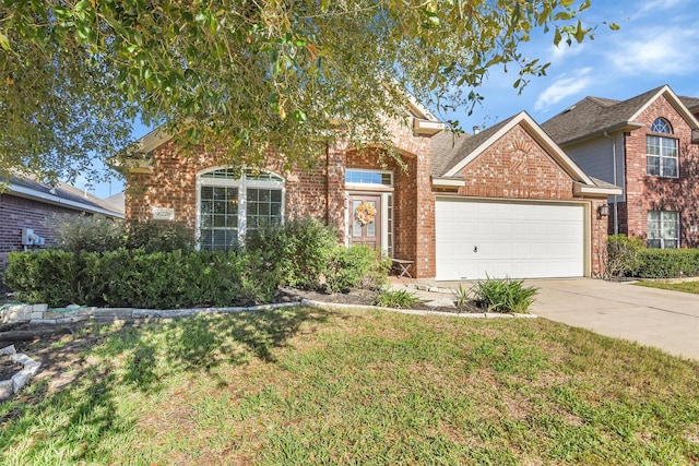 8226 Point Pendleton Dr, Tomball, TX 77375 - view of front of home with brick siding, an attached garage, driveway, and a front lawn