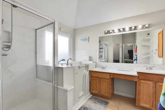 bathroom with tile patterned floors, vanity, an enclosed shower, and lofted ceiling