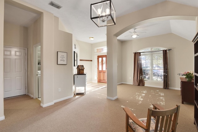 8226 Point Pendleton Dr, Tomball, TX 77375 - carpeted foyer featuring arched walkways, a ceiling fan, baseboards, and vaulted ceiling