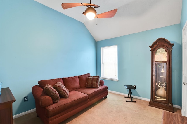 living room featuring light colored carpet, ceiling fan, and lofted ceiling