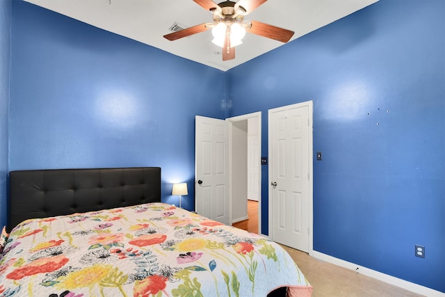 bedroom featuring ceiling fan and light colored carpet