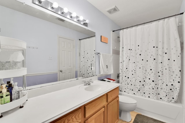 full bathroom featuring tile patterned floors, vanity, shower / tub combo, and toilet