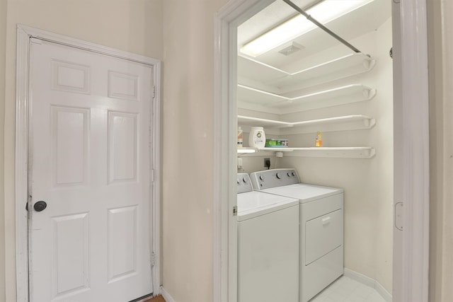 laundry area featuring washer and clothes dryer