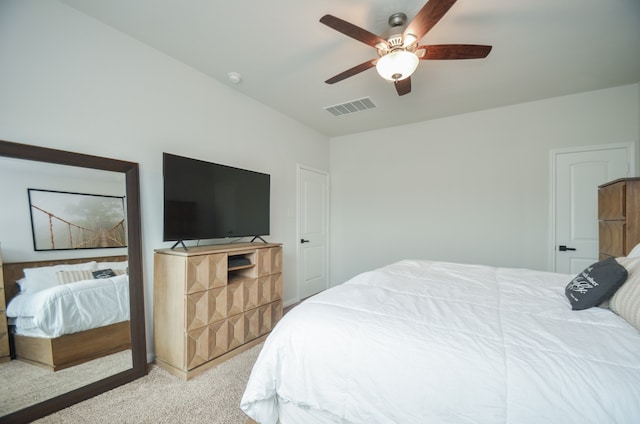 bedroom featuring ceiling fan and light carpet