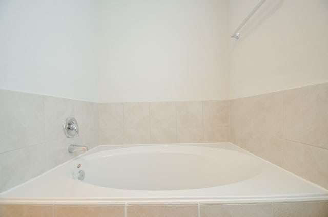 bathroom featuring tiled bath