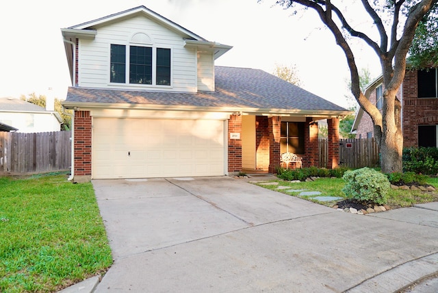 front facade featuring a front yard and a garage