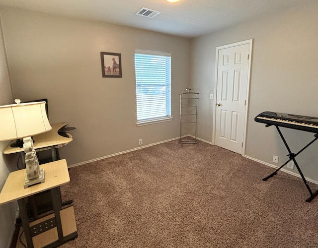 misc room featuring dark colored carpet