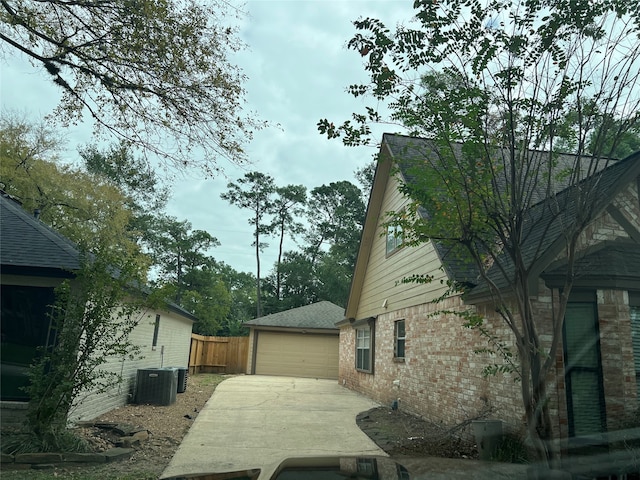 view of side of property with central AC