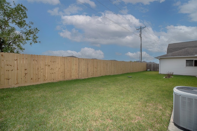 view of yard with central AC