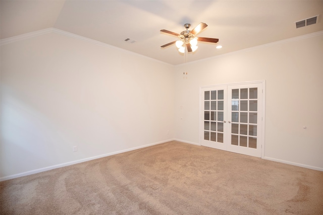 spare room with french doors, vaulted ceiling, carpet flooring, ceiling fan, and ornamental molding