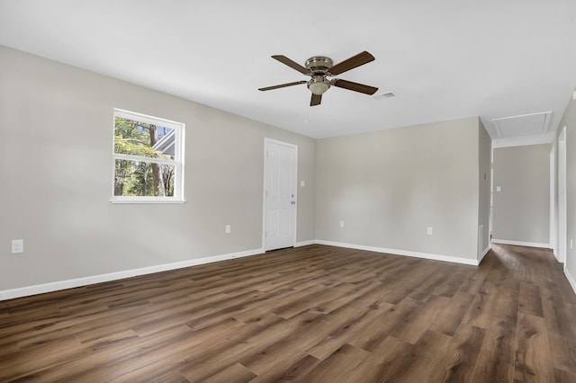 unfurnished room featuring ceiling fan and dark wood-type flooring