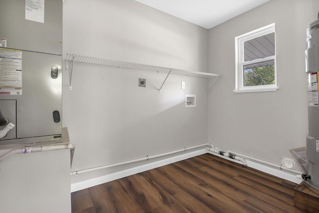 laundry room featuring hookup for an electric dryer, dark wood-type flooring, and washer hookup