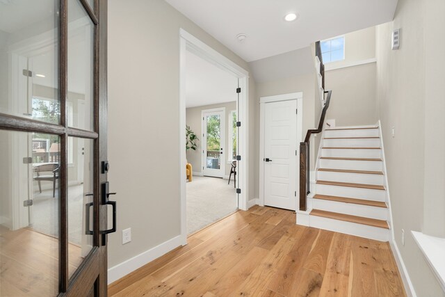 entryway with light hardwood / wood-style flooring