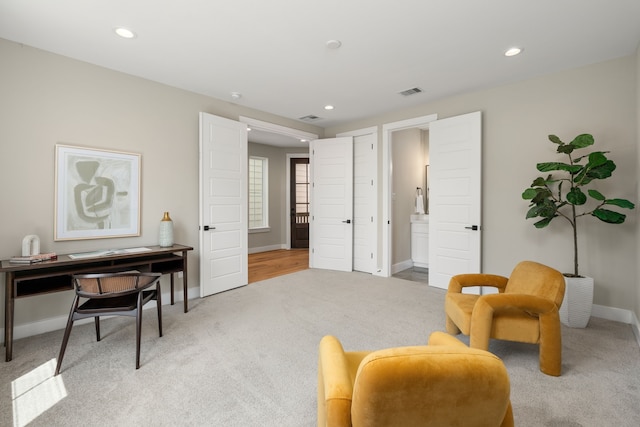 living area featuring carpet flooring