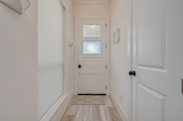 doorway to outside with light hardwood / wood-style flooring