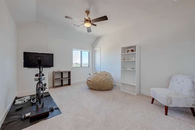 workout room featuring carpet, ceiling fan, and vaulted ceiling