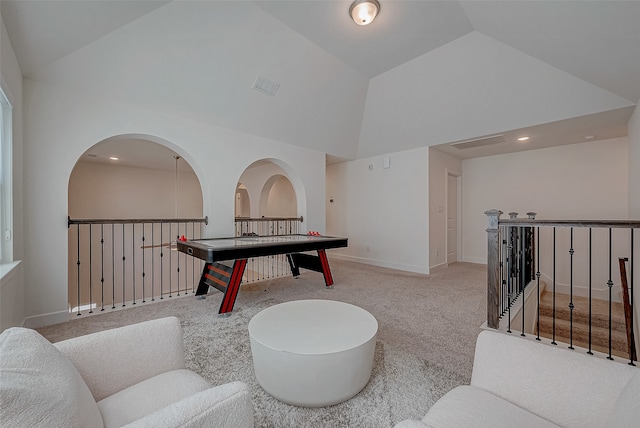 game room with light colored carpet and vaulted ceiling