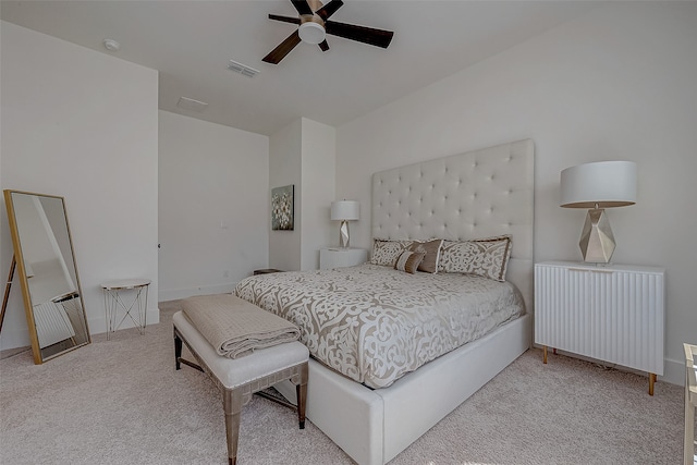 bedroom featuring ceiling fan, light carpet, and radiator