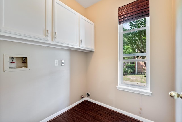 laundry area with cabinets, hookup for a washing machine, dark wood-type flooring, and hookup for an electric dryer