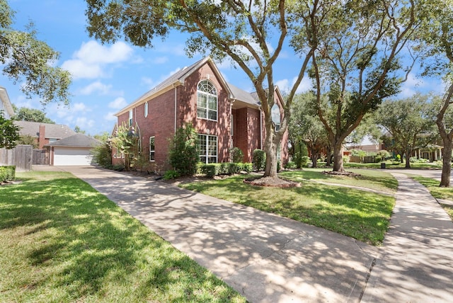 front of property featuring a front yard and a garage