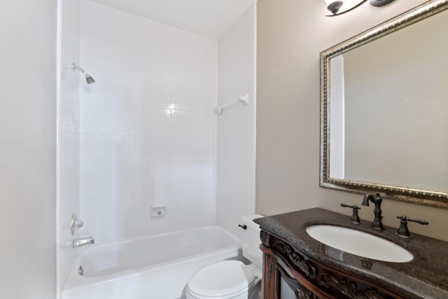 full bathroom featuring vanity, tiled shower / bath combo, and toilet