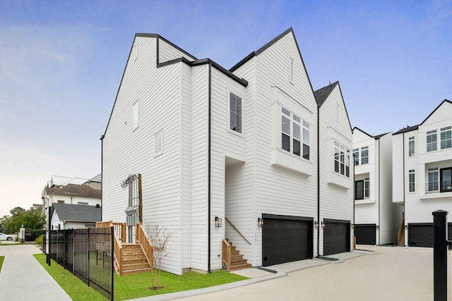 view of side of home with a garage