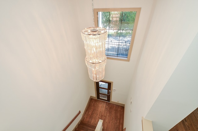 interior space featuring a notable chandelier and dark wood-type flooring