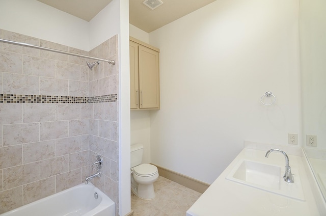 full bathroom featuring vanity, tile patterned floors, tiled shower / bath combo, and toilet