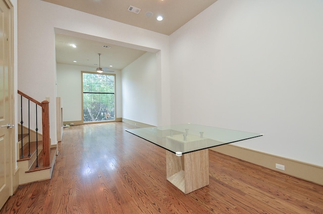 unfurnished dining area with ceiling fan and light hardwood / wood-style floors