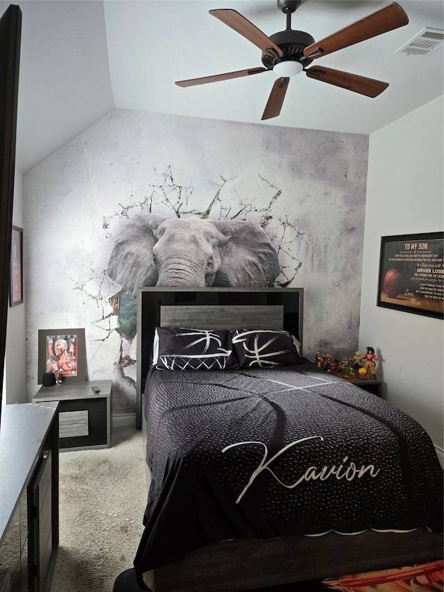 carpeted bedroom featuring vaulted ceiling and ceiling fan