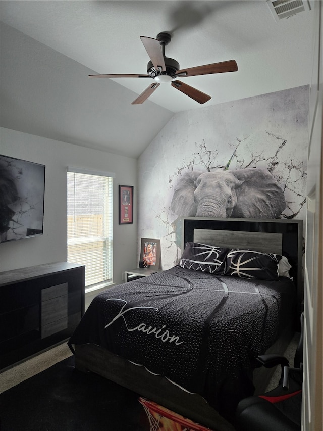 bedroom featuring ceiling fan and vaulted ceiling