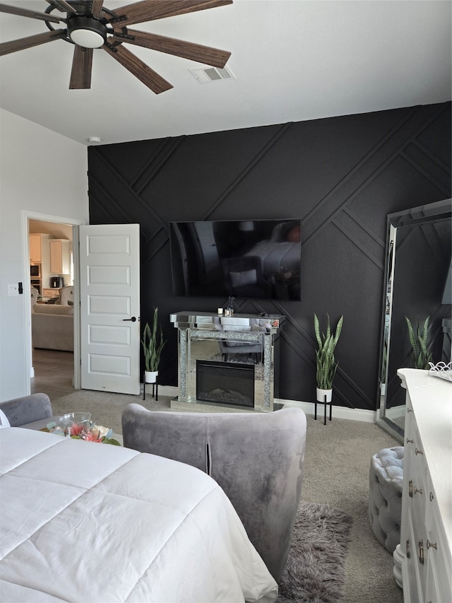 carpeted bedroom with ceiling fan