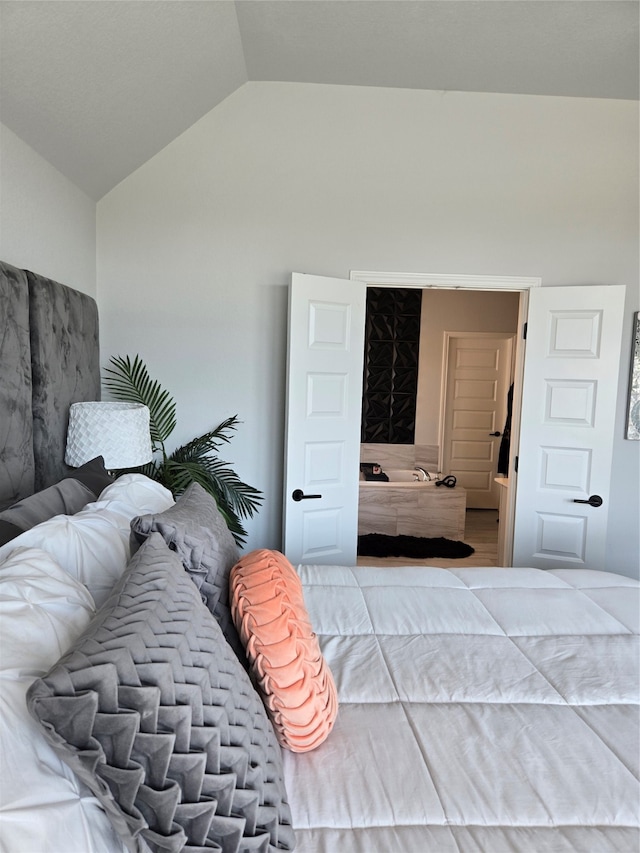 bedroom featuring vaulted ceiling