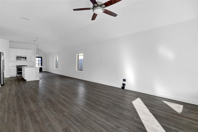 unfurnished living room with ceiling fan, dark hardwood / wood-style flooring, and vaulted ceiling