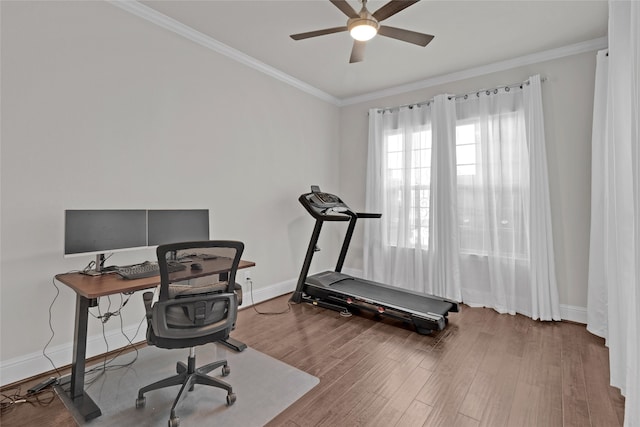 office space with ceiling fan, wood-type flooring, and ornamental molding