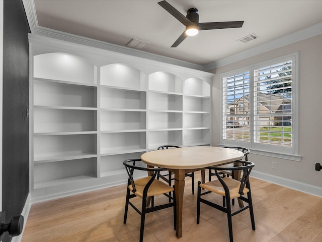 dining space featuring light hardwood / wood-style flooring, ceiling fan, and ornamental molding