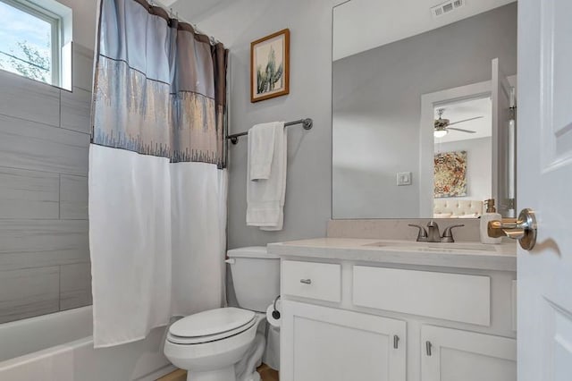 full bathroom featuring vanity, ceiling fan, shower / bathtub combination with curtain, and toilet