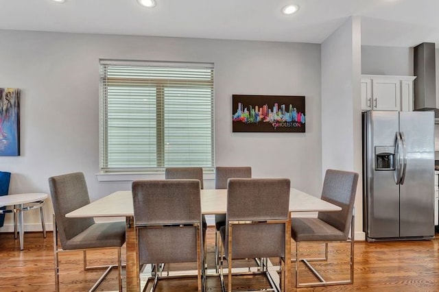 dining area with light hardwood / wood-style floors